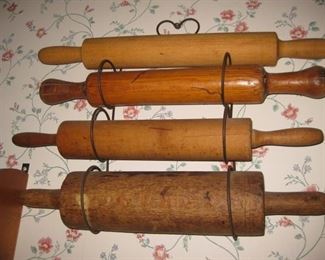 Antique rolling pins and display rack