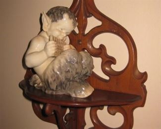 Wood carved wall shelf; Royal Copenhagen "Faun Playing Pipes"