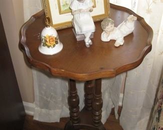 Small 3-legged pie crust table; B&G knitting girl; Lladro angel boy