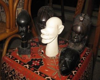 African head busts, ebony and stone