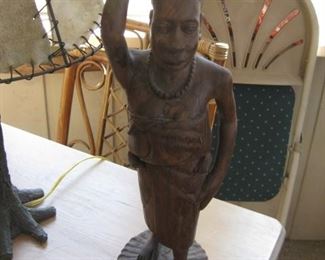 African carved statue signed