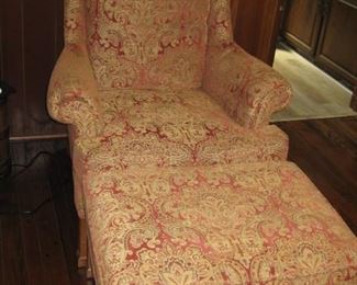 Red and gold upholstered chair and ottoman