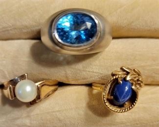 Item 163:  14K Gold and Topaz Ring (top):  $525 
Item 164:  10K Gold and Pearl Ring (2nd row left):  $145                                                                                                        
Item 165:  14K Gold and Star Sapphire Ring (2nd row right):  $225(SOLD)