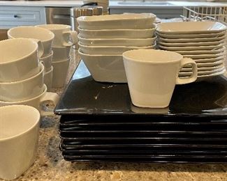 Item 274:  (11) Crate and Barrel Kahla Germany Cups: $45    (8) Black West Elm Plates: $32. (5) Crate and Barrel Kahla Germany Bowls: $38  (12) small bread plates by Crate and Barrel Kahla Germany:  $48