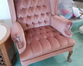 pinkish velvety wingback tufted chair