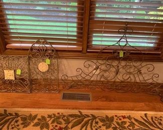 Several decorative wrought iron wallhangers