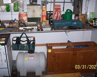 Old wood burner, small tank, wall cabinet, assorted tools