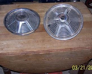 Sample of Mustang hubcaps, drop leaf table