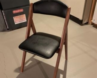 There are four of these great leather-like folding chairs