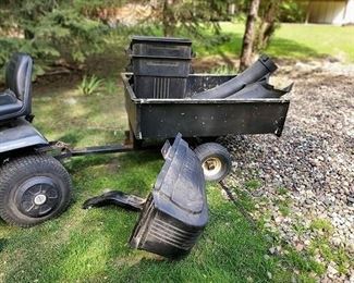 Riding mower has a trailer  as well as a complete grass/leaf collection unit
