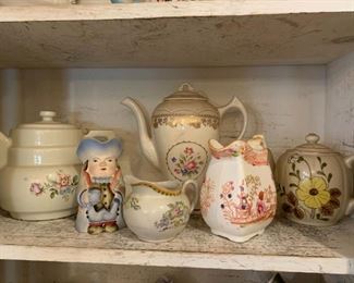 large selection of vintage teapots, creamers and sugars