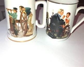 An assortment of Norman Rockwell mugs