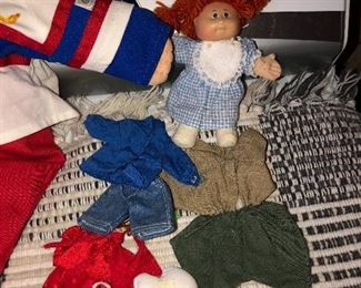 Here we have a dolly for a Cabbage Patch doll and lots of clothes