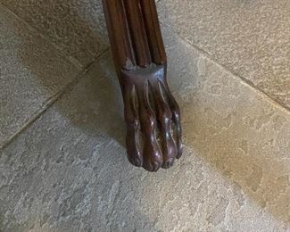 Close up of the carved feet on the card table