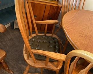 Solid Oak Dining Table with 4 leaves and 8 chairs (2 captain's chairs)