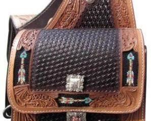 22	

Basket weave and leaf tooled leather saddle bag with beaded arrow inlay.
Basket weave and leaf tooled leather saddle bag. This saddle bag features dark leather basket weave tooled center with medium oil leaf tooled edging. Accented with beaded arrow inlay on edging and features one buckle closure on each side. Comes equipped with front D rings. Bag measures 10" x 10" x 3" with a 4" gusset. 
59.00
 
