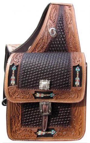 22	

Basket weave and leaf tooled leather saddle bag with beaded arrow inlay.
Basket weave and leaf tooled leather saddle bag. This saddle bag features dark leather basket weave tooled center with medium oil leaf tooled edging. Accented with beaded arrow inlay on edging and features one buckle closure on each side. Comes equipped with front D rings. Bag measures 10" x 10" x 3" with a 4" gusset. 
59.00
 