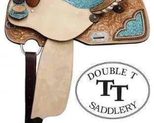 51	

NEW 14 Inch Double T Barrel Style Saddle with Filigree Print Seat.
Double T Barrel Style Saddle with Filigree Print Seat. This saddle features teal colored seat with filigree pattern. Floral tooled skirts feature with cut out filigree print accented copper colored studs. Tooled cantle is accented with silver laced rawhide. Bell stirrups feature filigree print with leather tred. Saddle is accented with copper colored conchos and engraved silver rigging plate. Saddle comes equipped with D-rings on front of skirts and leather latigo tie strap and off billet. Made by Double T Saddlery. 