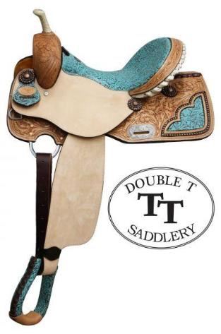 51	

NEW 14 Inch Double T Barrel Style Saddle with Filigree Print Seat.
Double T Barrel Style Saddle with Filigree Print Seat. This saddle features teal colored seat with filigree pattern. Floral tooled skirts feature with cut out filigree print accented copper colored studs. Tooled cantle is accented with silver laced rawhide. Bell stirrups feature filigree print with leather tred. Saddle is accented with copper colored conchos and engraved silver rigging plate. Saddle comes equipped with D-rings on front of skirts and leather latigo tie strap and off billet. Made by Double T Saddlery. 