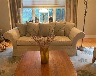 NEUTRAL ETHAN ALLEN SOFA  AND FLORAL RUG