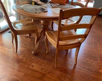beautiful table with 4 chairs and one leaf