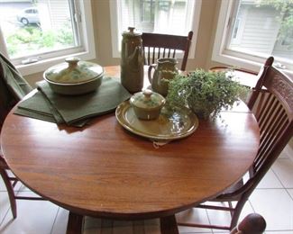 Round dining Table with 4 press back chairs and vintage Franciscan tableware