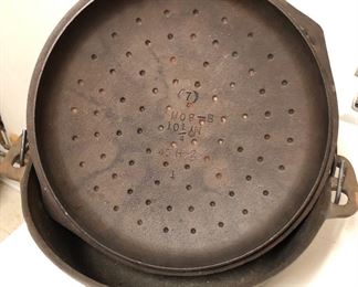 Cast Iron Dutch Oven featuring markings on the lid of this piece. No. (7) NO B 10-1/4” 45 H-2 1