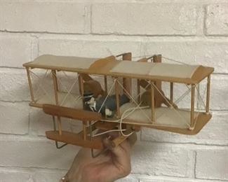 Marvelous bi-plane replica.  Rotors are battery operated.  Can be hung as a mobile in an office for a airplane efficinato.  In excellent shape!