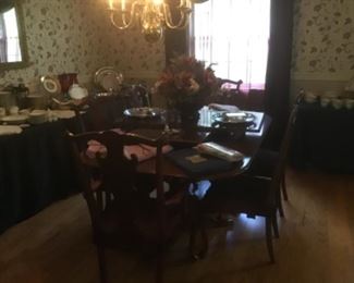 Lovely Cherry double peristalsis Dining Table and 6 chairs.  Boasts2 large leaves that extend the table to 103”.  