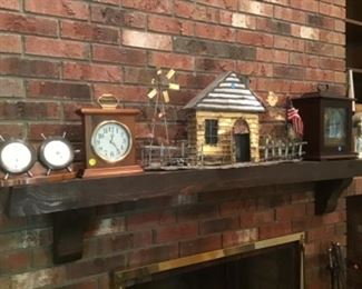 Folk art cabin and assortment of clocks. Coo coo clock on wall also not pictured