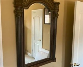 Wood framed arched mirror