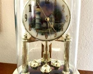 **sold**

Thomas Kincaid Lighthouse Anniversary Clock With Revolving Pendulum 
-Pool House 