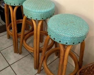 Amazing Rattan bar stools with vintage textured vinyl seats. 
- Pool House 