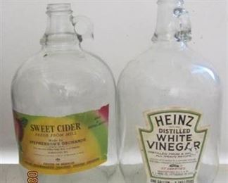 2   Vintage gallon glass jugs each with label no chips