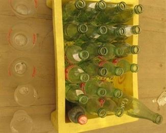 Yellow plastic coke case with coke bottles and coke glasses