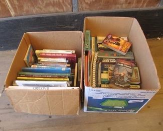 2 boxes with Tom Clancy and Dan Brown books