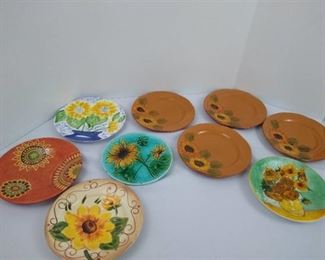 9 assorted sunflower themed plates