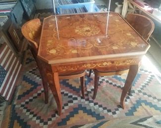 Game table with several tops for different games and a roulette wheel