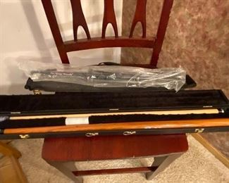 Pool cue in case, musical instrument stand
