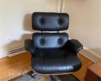 2, second generation, Eames by Herman Miller Rosewood lounge chairs, with 1 ottoman. Charles and Ray Eames
(2) 670 lounge chair and (1) 671 ottoman
Herman Miller
USA, 1956 / c. 1970
molded rosewood plywood, leather, enameled steel 33½ w × 33½ d × 32½ h in 85 × 85 × 83 cmOttoman measures: 16 w x 25.75 d x 21.5 h inches.
Paper manufacturer's label to underside of each element ‘Herman Miller Inc. Zeeland, Michigan’. Metal manufacturer's label to underside of each element 'Herman Miller'. 
33w x 33d x 33h
