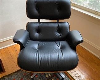 2, second generation, Eames by Herman Miller Rosewood lounge chairs, with 1 ottoman. Charles and Ray Eames
(2) 670 lounge chair and (1) 671 ottoman
Herman Miller
USA, 1956 / c. 1970
molded rosewood plywood, leather, enameled steel 33½ w × 33½ d × 32½ h in 85 × 85 × 83 cmOttoman measures: 16 w x 25.75 d x 21.5 h inches.
Paper manufacturer's label to underside of each element ‘Herman Miller Inc. Zeeland, Michigan’. Metal manufacturer's label to underside of each element 'Herman Miller'. 33w x 33d x 33h
