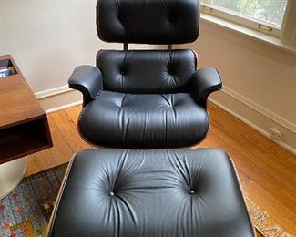 2, second generation, Eames by Herman Miller Rosewood lounge chairs, with 1 ottoman. Charles and Ray Eames
(2) 670 lounge chair and (1) 671 ottoman
Herman Miller
USA, 1956 / c. 1970
molded rosewood plywood, leather, enameled steel 33½ w × 33½ d × 32½ h in 85 × 85 × 83 cmOttoman measures: 16 w x 25.75 d x 21.5 h inches.
Paper manufacturer's label to underside of each element ‘Herman Miller Inc. Zeeland, Michigan’. Metal manufacturer's label to underside of each element 'Herman Miller'. 33w x 33d x 33h Ottoman 26 c 23 x 16