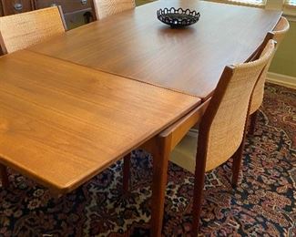 Jens Risom Rectangle dining table in Walnut with pull out inserts to extend seating With 6 dining chairs, 67w x 41d x 29h extends to 92 or 117w