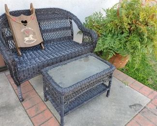 Rattan outdoor loveseat and coffee table (has 2 matching chairs)
