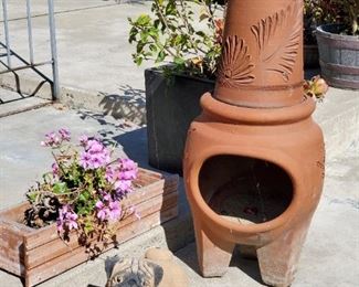 Chiminea, hibiscus plant in pot and (of course) pug doorstop