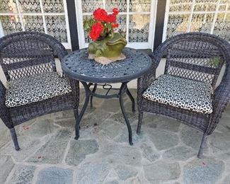 Black rattan patio chairs (we have a matching loveseat and coffee table), cute metal bistro table