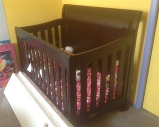 Convertible crib into twin bed.  Measures 32" d x 55" w.  Presale $245