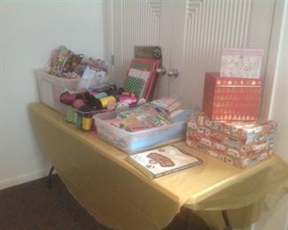 Lots of ribbon, boxes, tissue paper, multiple holiday bags