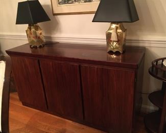 Rosewood credenza, very fine, from Scan.  Left third is furnished with shallow drawers lined with tarnish prevention green felt.  Right doors open to large cupboard with one shelf.  Slight white moisture spot is just to the right of the center, otherwise perfect.  $950