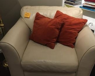 Leather over sized chair, extremely comfortable.  Wood legs do show despite this poor photo.  Color is much whiter than this, which looks gold.   $150